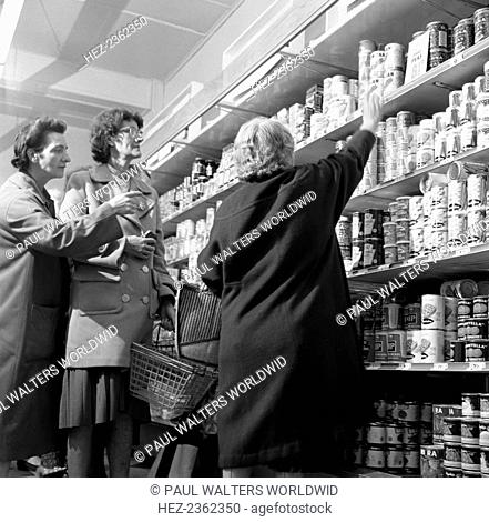 Opening of Brough's supermarket, Thurnscoe, South Yorkshire, 1963. At least one shopper finds the top shelf a little too high in the newly re-furbished Brough's...