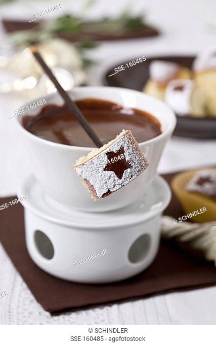 Chocolate Fondue and a piece of brioche on a skewer