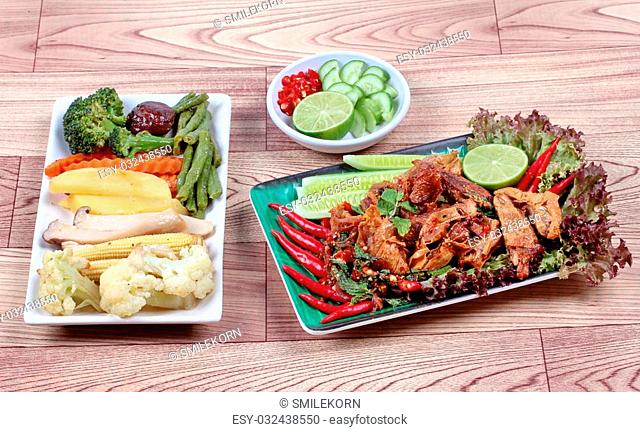Spicy and sour mixed herb salad with fried stir taro in tofu sheet and fried mixed vegetables served with side dish are food for Vegetable festival of Chinese...