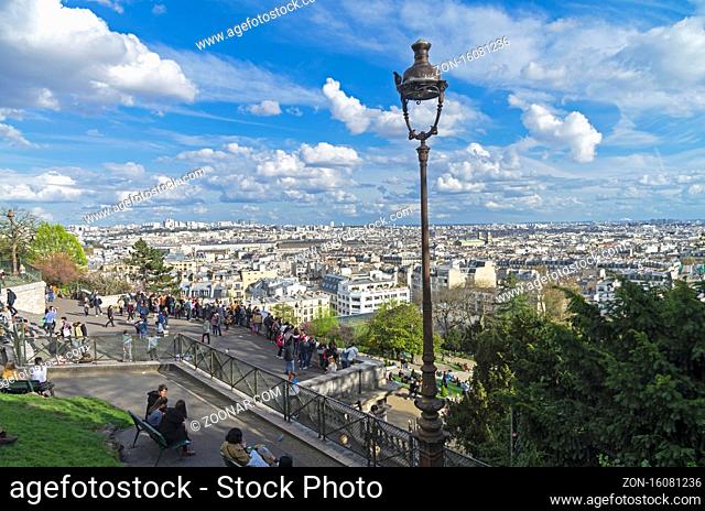 PARIS, FRANCE - APRIL 1, 2017: View from the hill of Montmartre to the north-eastern part of Paris. A sunny evening in early April