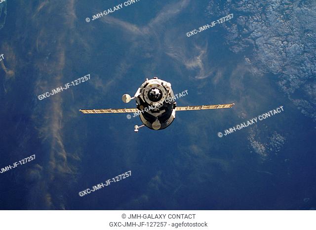 An unpiloted ISS Progress resupply vehicle approaches the International Space Station, carrying 1, 940 pounds of propellant, 110 pounds of oxygen and air