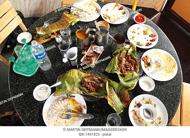 Table in restaurant after eating fish, Alleppey, Kerala, India, South Asia, Asia