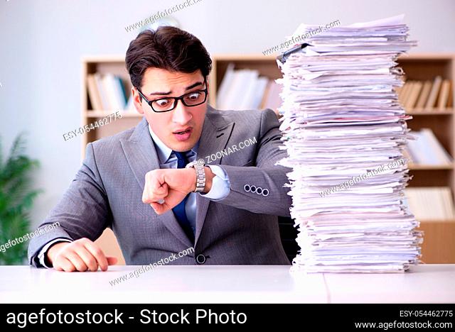 Businessman struggling to meet challenging deadlines