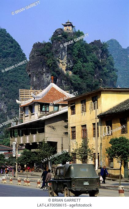 Yangshuo is a small town in Guilin, Guangxi Province, China, and the seat of Yangshuo County which is surrounded by towering limestone rock formations or tree...