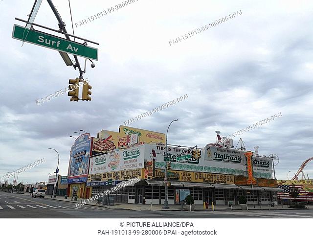 10 September 2019, US, New York: The original fast food restaurant of the Nathan's chain ""Nathan's Famous"" on the corner of Surf Avenue and Stillwell Avenue...