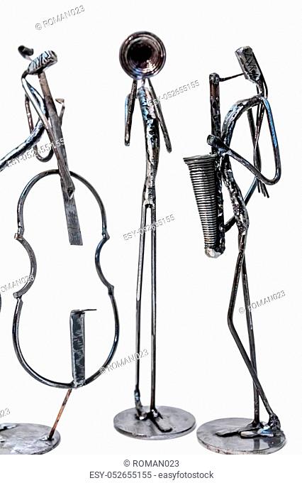 Figures of music performers made with welded black metal wire. Violoncellist, trumpeter and saxophonist are playing together. Living lines
