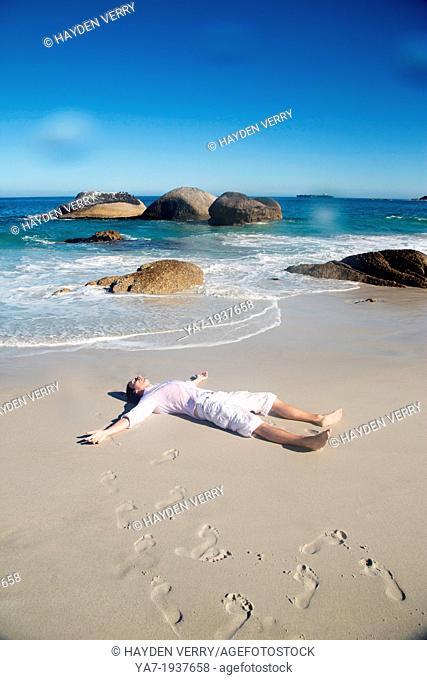 Man Lying on Beach