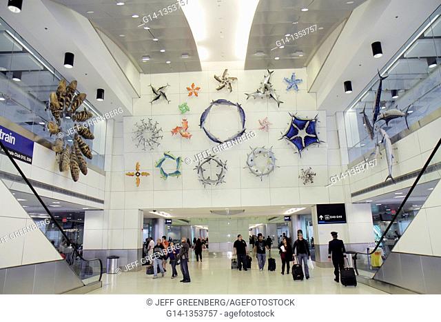 Florida, Miami, Miami International Airport, MIA, aviation, North Terminal, concourse, escalator, man, woman, passenger, public art, artwork, sculpture