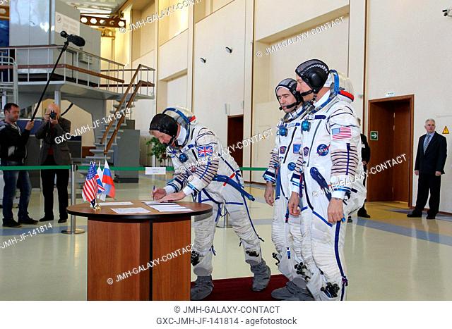 At the Gagarin Cosmonaut Training Center in Star City, Russia, Expedition 4445 backup Flight Engineer Timothy Peake of the European Space Agency signs in for...