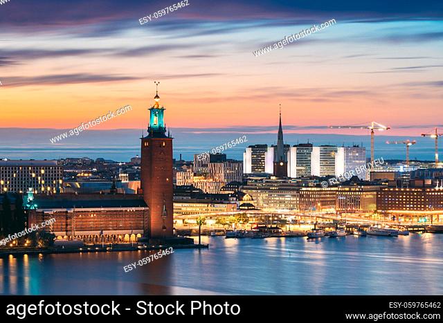 Stockholm, Sweden. Scenic Skyline View Of Famous Tower Of Stockholm City Hall And St. Clara Or Saint Klara Church. Popular Destination Scenic View In Sunset...