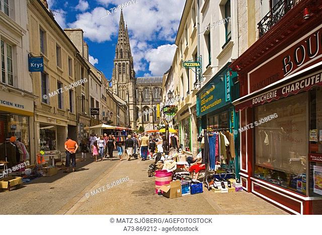 Street market and Notre Dame Cathedral in background on 14 July (French national holiday), Sees. Orne, Basse-Normandie, France