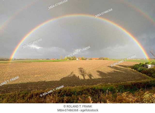 Germany, Lower Saxony, East Frisia, rainbow over the Emden district Logumer Vorwerk