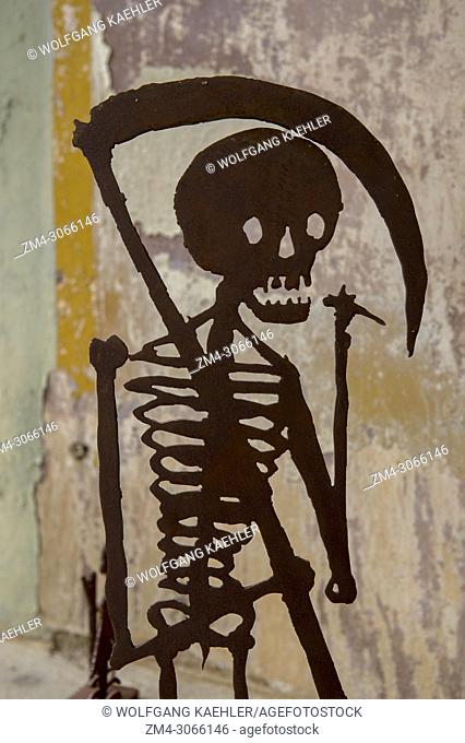 A metal silhouetted skeleton on display in an art exhibit in Oaxaca City, Mexico
