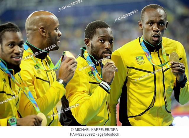 (L-R) Gold medalists Yohan Blake, Asafa Powell, Nickel Ashmeade, Usain Bolt of Jamaica celebrate during the medal ceremony of the men's 4x100m relay final of...