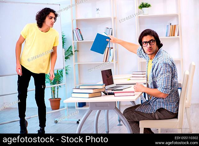 Two male students in the classroom