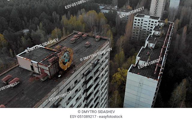 Soviet coat of arms on a high-rise building in Pripyat. City of Pripyt near the Chernobyl nuclear power plant