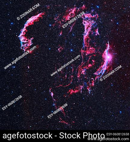 The Veil Nebula or NGC 6960 is a cloud of heated and ionized gas and dust in the constellation Cygnus. Retouched colored image