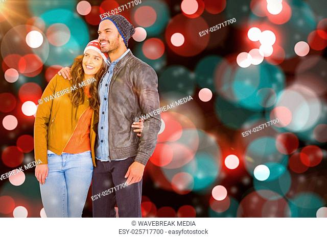 Composite image of young couple embracing and looking away