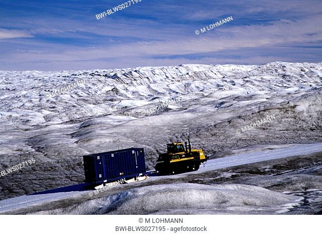 transporting a container over car testing road through inland ice