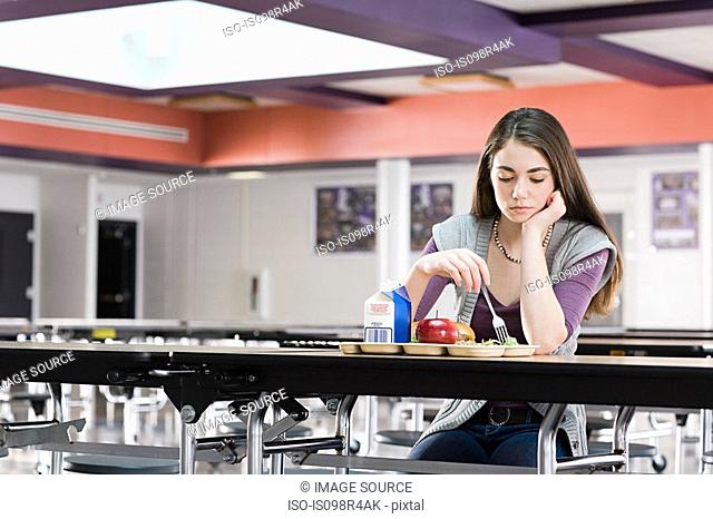 Girl alone at lunch