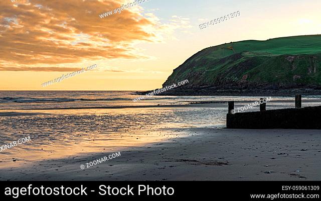 Evening mood and dark clouds over the beach and the St Bees Heritage Coast near Whitehaven in Cumbria, England, UK