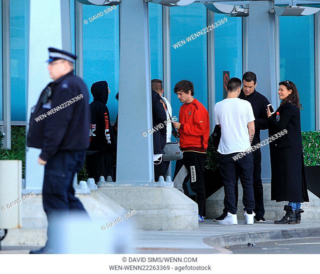 One Direction arrive back in London from their world tour in Tokyo Featuring: Louis Tomlinson, Liam Payne Where: London, United Kingdom When: 03 Mar 2015...