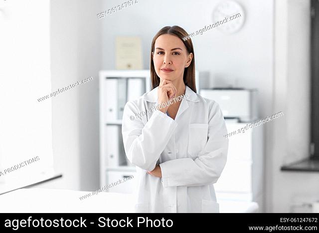 thinking female doctor at hospital