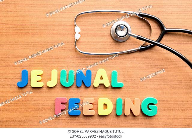 Jejunal feeding colorful word with stethoscope on the wooden background