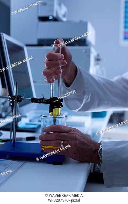Male scientist experimenting in laboratory