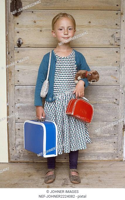 Girl with suitcases