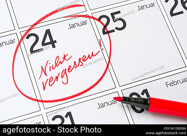 Save the Date written on a calendar - January 24 - Nicht vergessen in german