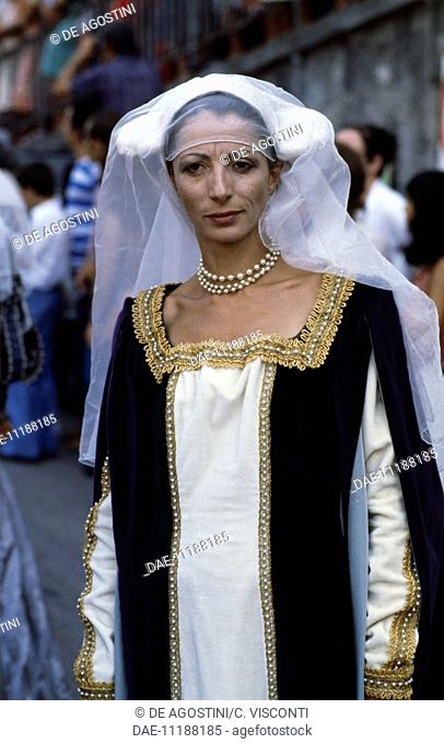 Woman wearing a period costume, rowing race in Ventimiglia, Liguria, Italy