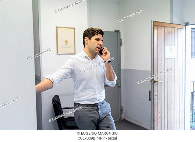 Man on telephone call in office