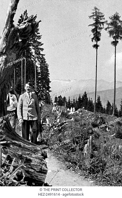 Adolf Hitler taking a walk in the mountains, 1936. Hitler (1889-1945) enjouying a walk on one of his visits to his mountain retreat at Obersalzberg in the...