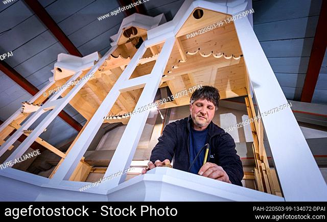 02 May 2022, Mecklenburg-Western Pomerania, Pinnow: Christian Mrzik works in the new organ for the 14th century village church