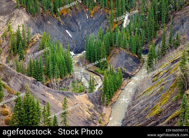 Aerial view of a mountain creek in a deep canyon, Rocky Mountains, Canada
