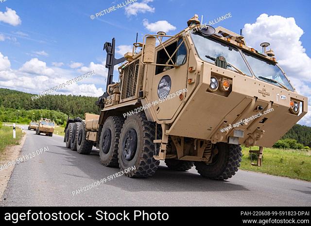 08 June 2022, Bavaria, Hohenfels: Three Autonomous Transport Vehicles (ATV) stand on a road during a demonstration. The newly unveiled US Army vehicles are...