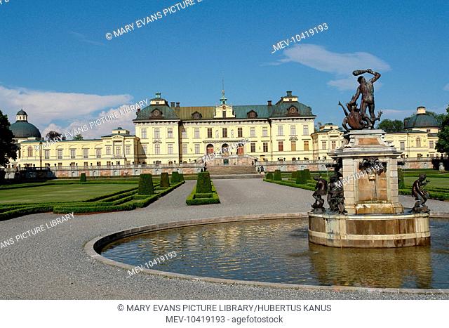 View of Drottningholm Palace and part of the Park, in Stockholm County, Uppland, Sweden, with a fountain in the foreground