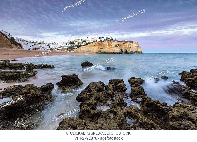 Sunset on the village of Carvoeiro surrounded by sandy beach and clear sea Lagoa Municipality Algarve Portugal Europe