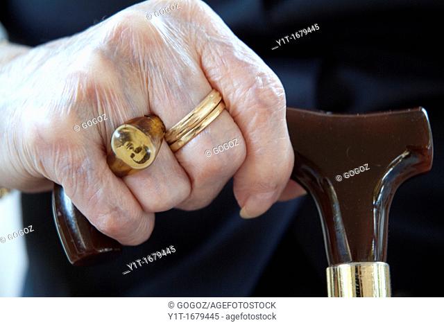 elderly woman's hand with rings