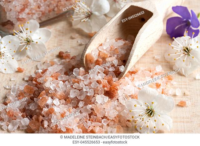 Pink Himalayan sea salt on a wooden background