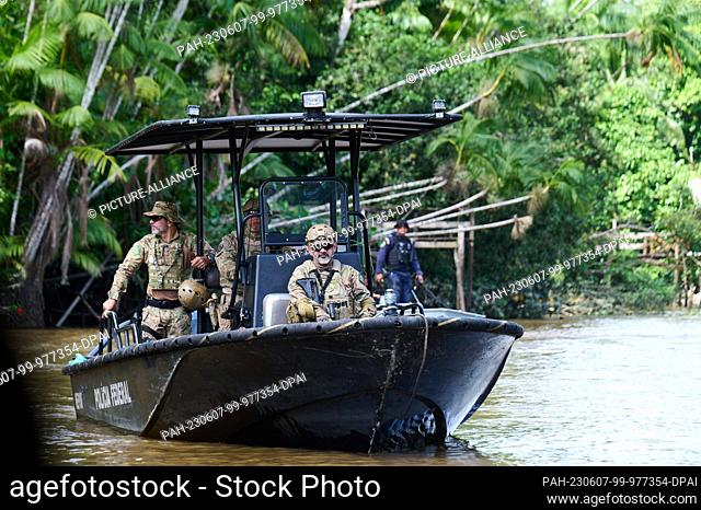 07 June 2023, Brazil, Belem: Brazilian security forces are on a boat at the mouth of the Rio Guama in Marajo Bay next to Combu Island (Ilha do Combu) near Belem