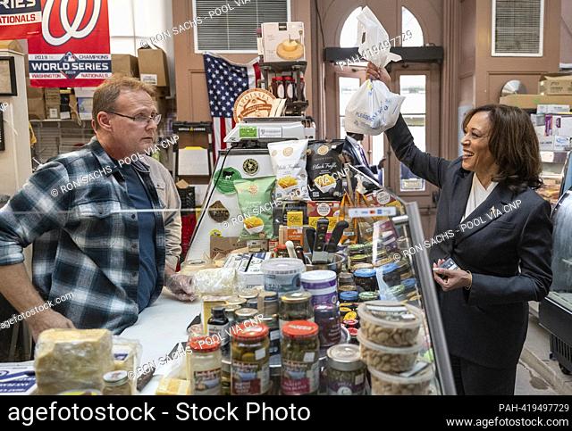 United States Vice President Kamala Harris, right, purchases cheese at Bowers Fancy Dairy Products Stand No. 400, a retail establishment located in the Eastern...