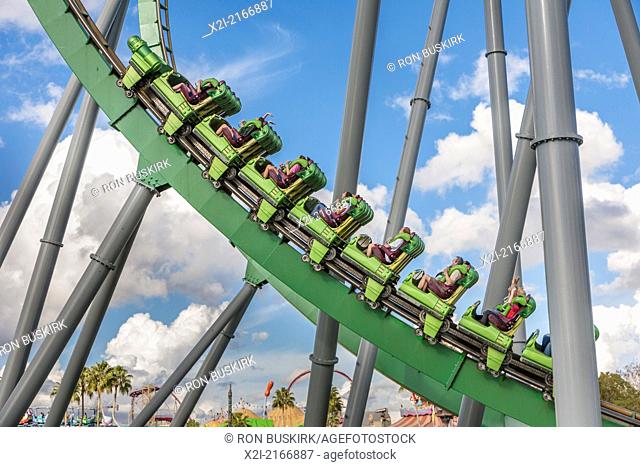 Park guest riding the Incredible Hulk Roller Coaster in Marvel Super Hero Island at Universal Studios Islands of Adventure park