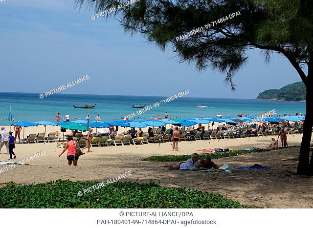 14 March 2018, Thailand, Karon Beach: Tourists sunbathing in Karon Beach on the island of Phuket. Photo: Alexandra Schuler/dpa