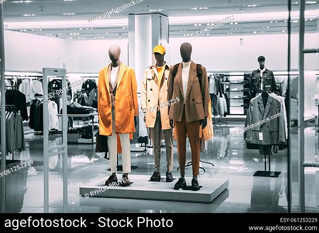 Mannequins Dressed In Men male Casual Clothes And coat jackets Clothes In Store Of Shopping Center. Stack clothes In Store Of Shopping Center