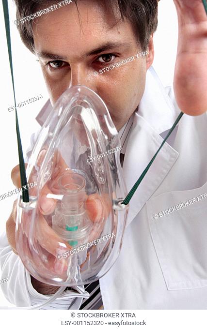 Doctor putting on oxygen mask