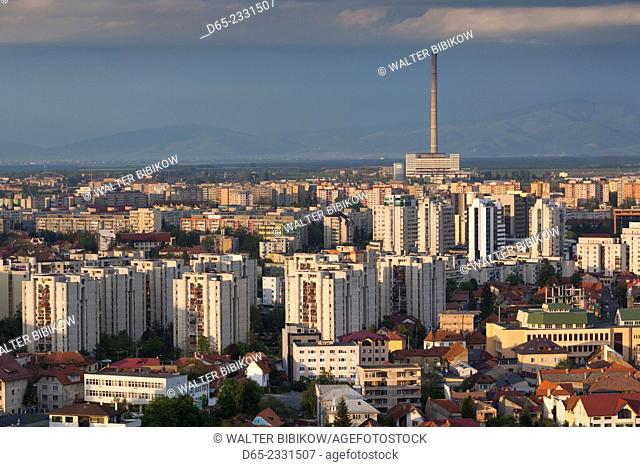 Romania, Transylvania, Brasov, new city and CET Brasov thermal energy plant, late afternoon