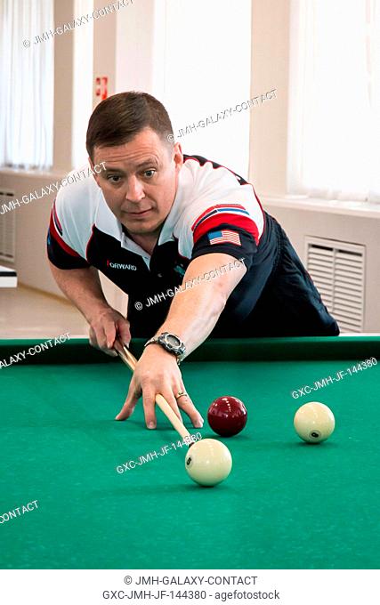At the Cosmonaut Hotel crew quarters in Baikonur, Kazakhstan, Expedition 51 crewmember Jack Fischer of NASA tries his hand in a game of billiards April 13 as...