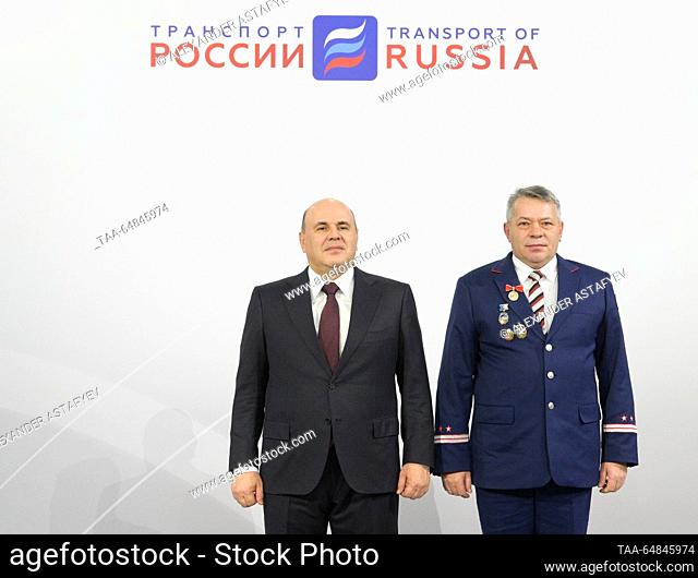 RUSSIA, MOSCOW - NOVEMBER 15, 2023: Russia's Prime Minister Mikhail Mishustin (L) presents Vladimir Moiseyev, driver-instructor of the Barnaul operating...